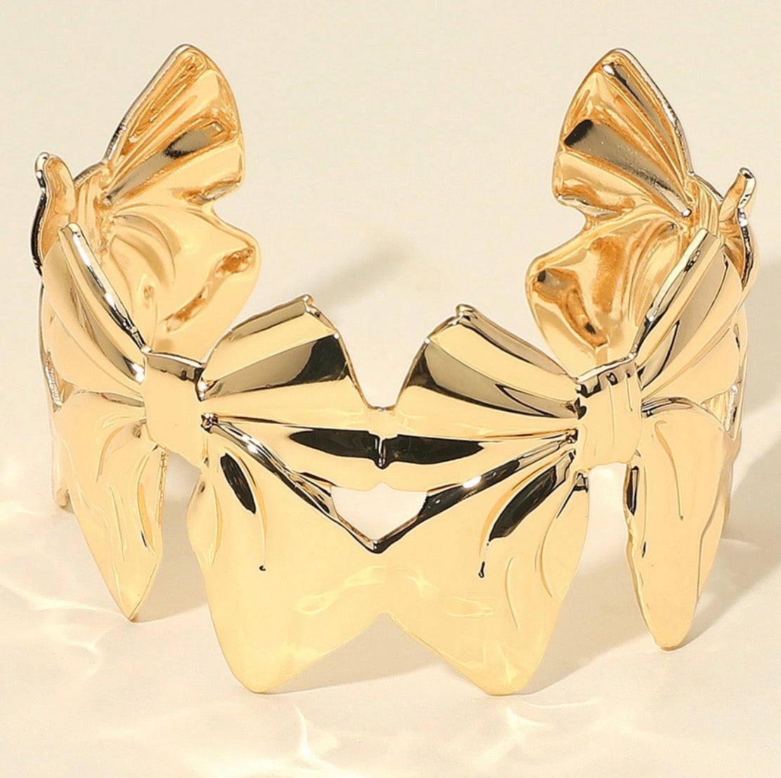 Gold bow stainless steel cuff